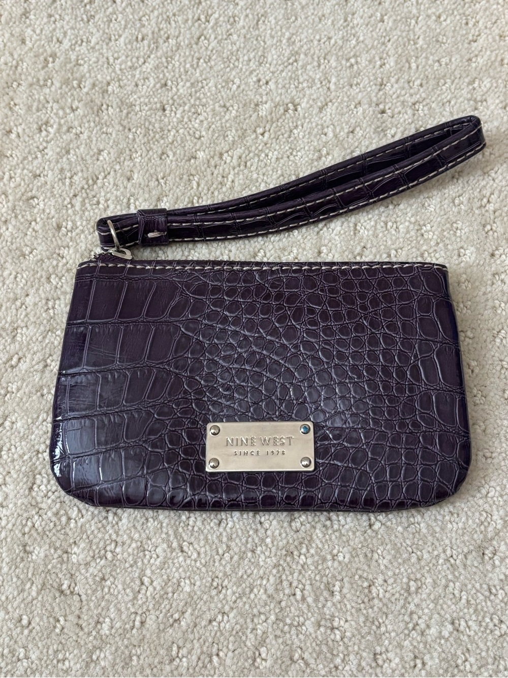 Nine West Croc-Embossed Wristlet in Plum with Silver Plaque